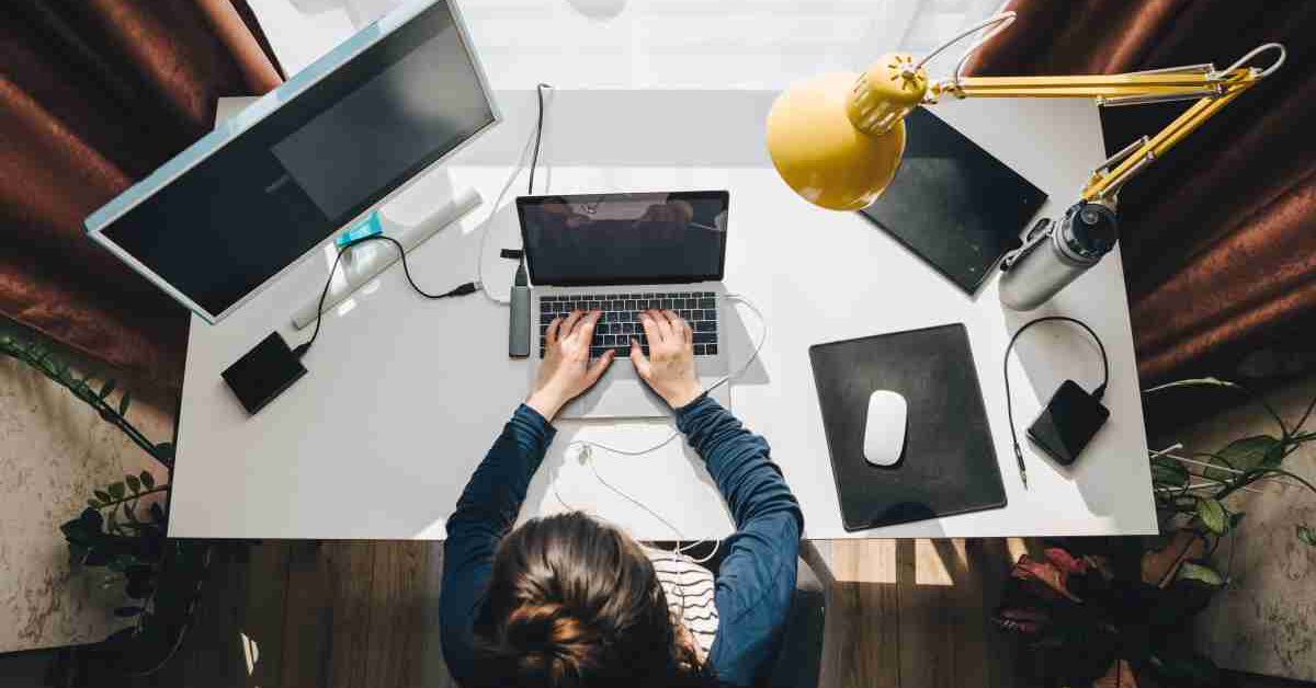 person typing on a laptop