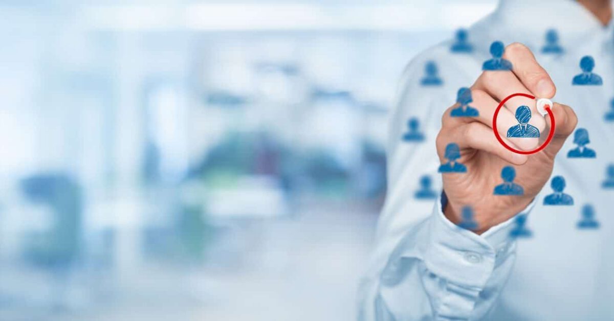 man drawing people with red circle