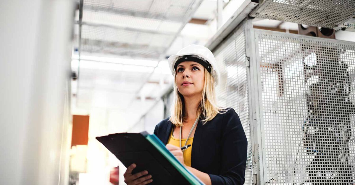 woman worker writing on a clipboard