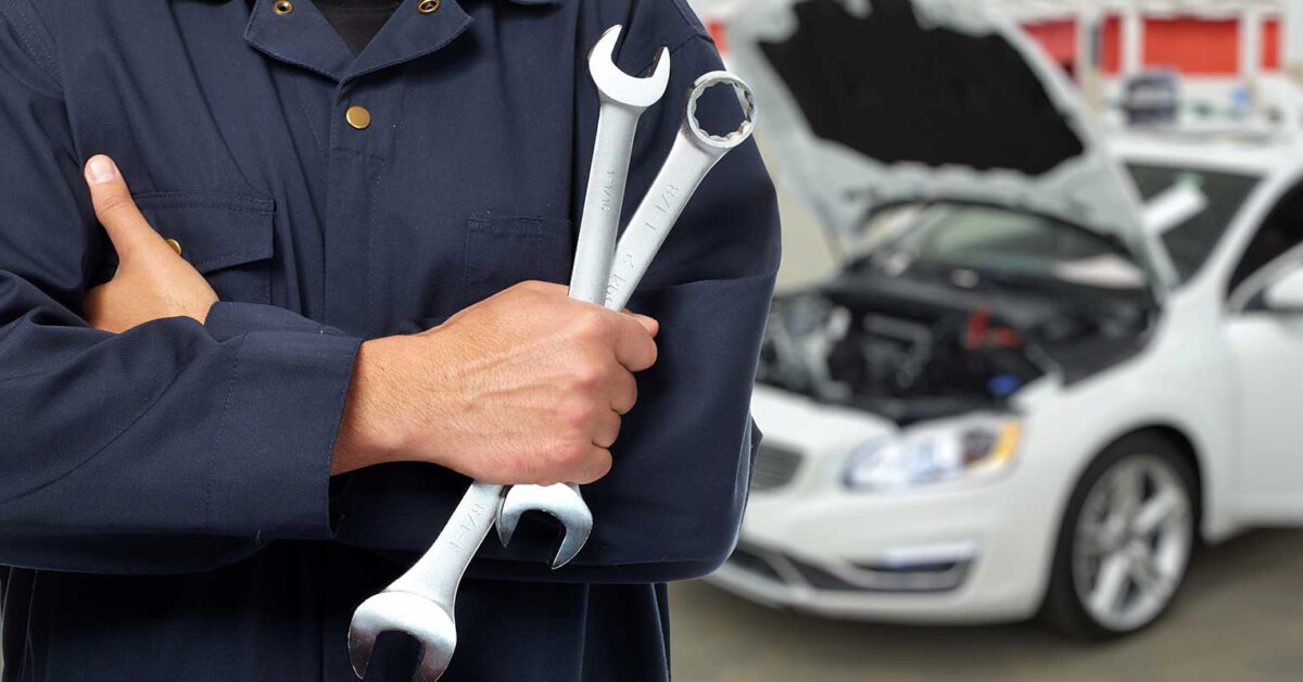 person holding wrenches