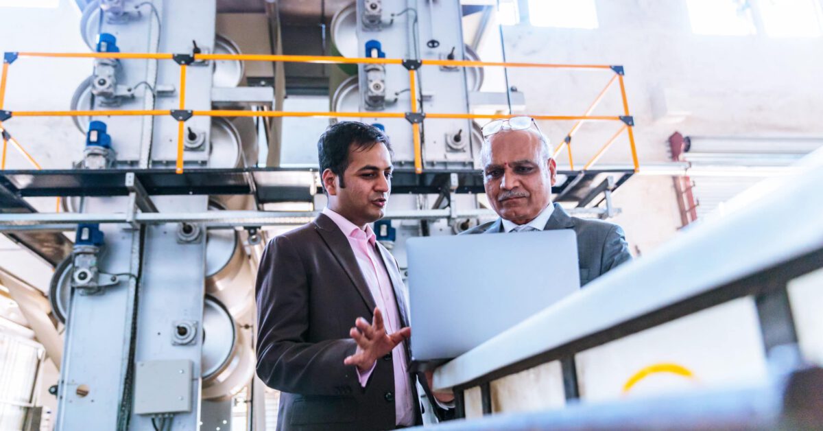Business men in a factory