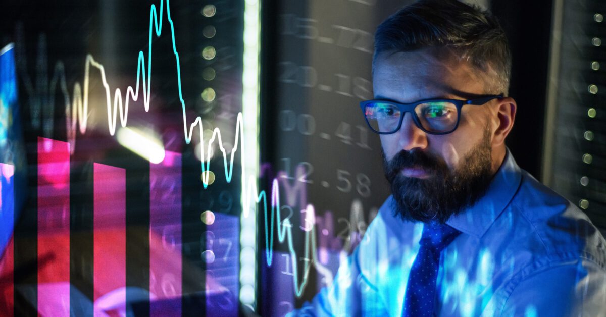 businessman with financial graphs